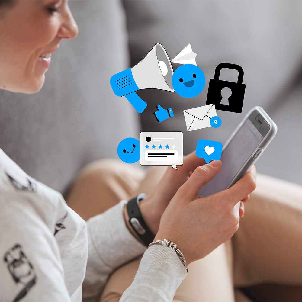 Woman holding phone with social media icons