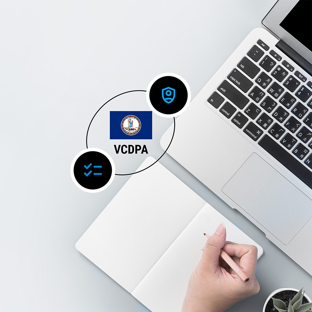 Computer with hand making notes and Virginia flag